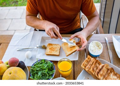 A Man At Breakfast. Toast In Hand. Cheese On Bread Toast. Breakfast Buffet. Morning With Food. Toast Bread With Philadelphia Cheese And Salmon. Orange Juice. Food At The Hotel. Binge Eating.Food Day