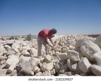 Man Breaking Stone, One Of The Ways To Break Stones Is To Cook And Break Them