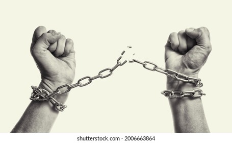 Man breaks the chains and gains freedom. The concept of gaining freedom. Black and white.