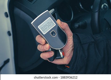 A Man With A Breathalyzer In The Car, Testing For Alcohol And Drug Intoxication Of The Driver, Selective Focusing Tinted Image