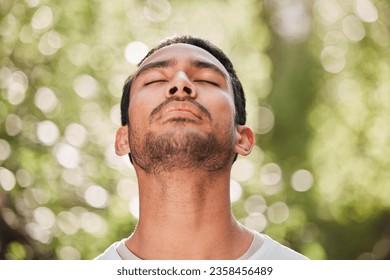 Man, breathing and relax with peace in nature for exercise, workout or meditation for zen after fitness for spiritual wellness. Calm, athlete and freedom in environment and training mindfulness