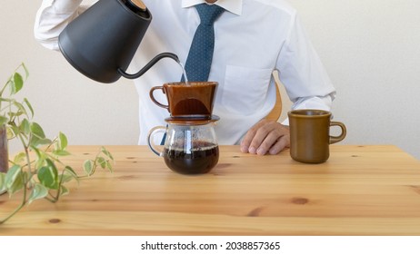 A Man Brewing Drip Coffee At Home.Break While Working From Home.