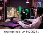 Man in brick wall living room playing video games on gaming PC at computer desk, enjoying day off from work. Gamer battling enemies in online multiplayer shooter from neon lights ornate home