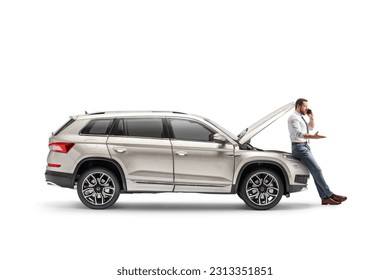 Man with a broken car calling road assistance isolated on white background