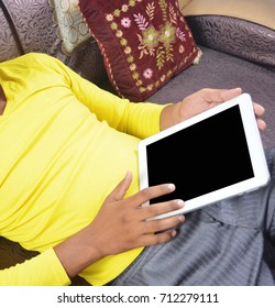 Man browsing on tablet pc blank screen isolated in the room