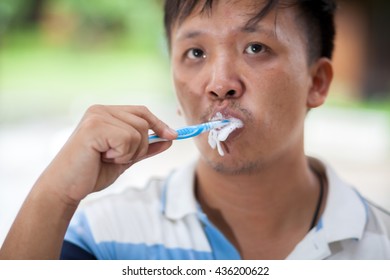 Man Brushing Teeth