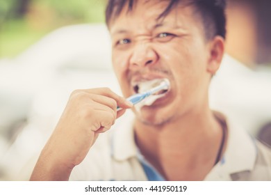 Man Brushing Teeth