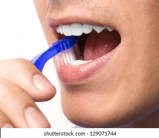 Man, Brushing Teeth With A Tooth Brush