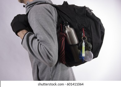 Man With Bug Out Bag On Gray Background