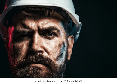Man builder. Closeup portrait of male architect, builder or engineer in hardhat. Building service. Serious construction worker in hard hat. Bearded industrial worker, foreman or repairman in helmet