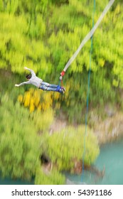 Man Bungee Jumping Off Kawarau Bridge In Queenstown New Zealand