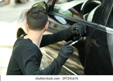 Man Burglar Stealing Car