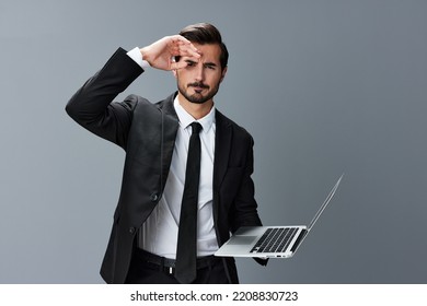 Man Business With Headache And Anger Business Negotiation Screams Online Internet By Video Call On Gray Background. Sadness And Failure To Cooperate