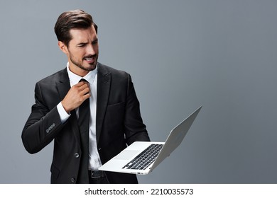 Man Business With Headache And Anger Business Negotiation Screams Online Internet By Video Call On Gray Background. Sadness And Failure To Cooperate