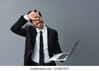 Man Business With Headache And Anger Business Negotiation Screams Online Internet By Video Call On Gray Background. Sadness And Failure To Cooperate