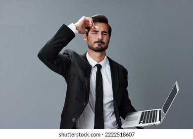 Man Business With Headache And Anger Business Negotiation Screams Online Internet By Video Call On Gray Background. Sadness And Failure To Cooperate