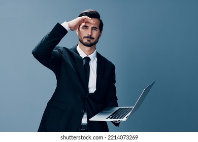 Man Business With Headache And Anger Business Negotiations Online By Video Call On Gray Background. Sadness And Failure To Cooperate