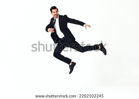 Similar – Young bearded man jumping in urban street