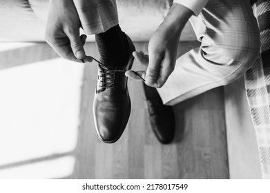 Man, Businessman Tying Shoelaces On Black Leather Shoes, Going To Work. Monochrome Photography, Top View, Business.