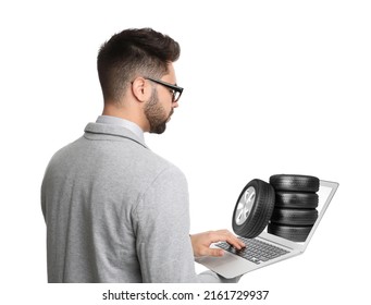 Man Buying Car Tires From Online Auto Store Via Laptop On White Background. Delivery Service