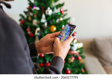 Man Buying Christmas, New Year Gifts Online Using Phone, Laptop