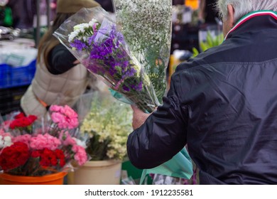 Man Buying Flowers In Spain