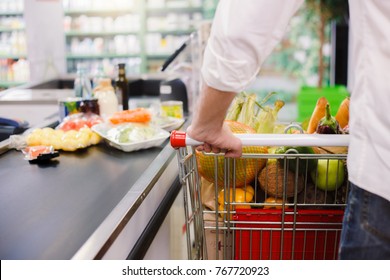Man buying food products in the supermarket shopping - Shutterstock ID 767720923
