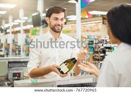 Man buying food products in the supermarket shopping