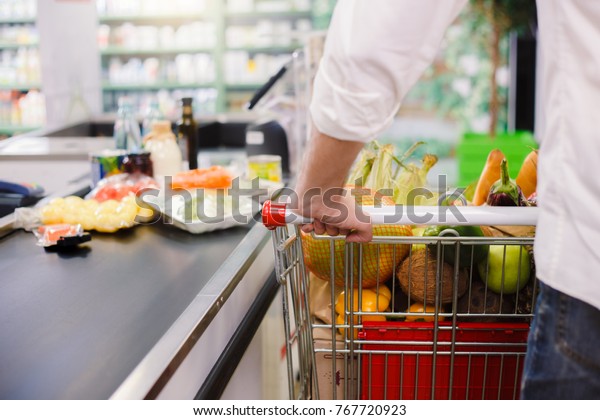 Man\
buying food products in the supermarket\
shopping