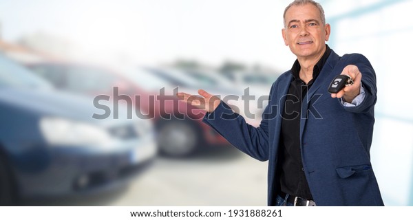 man buying or\
renting car with keys in\
hand