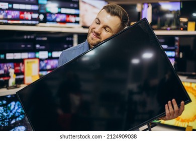 Man Buying Television At Store