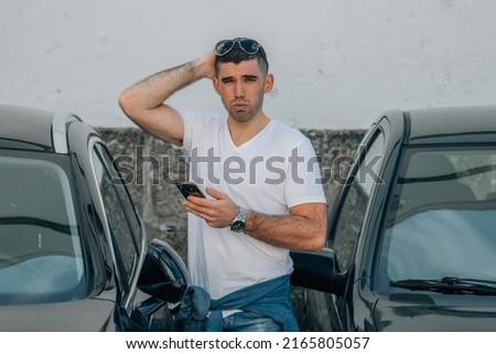 man buying used or second-hand car at dealership