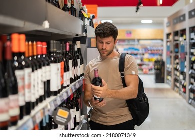 Man Buying Wine In Shop