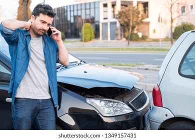 Man Calling Roadside Service After Car Crash