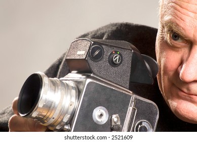 man with camera and laptop