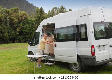 Man With Campervan On Campground - Coromandel, New Zealand