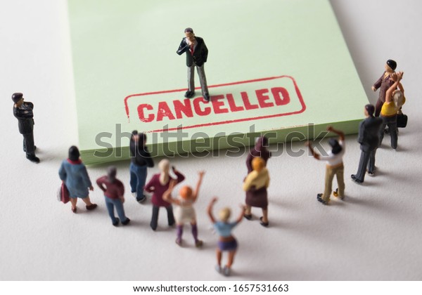 Man with cancelled stamp in front of angry mob.\
A person is the latest victim of toxic cancel culture. Man is\
bullied or excluded by friends, family, or social media followers.\
Offensive guy labelled.