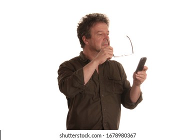 A man cannot read the small letters on the cell phone