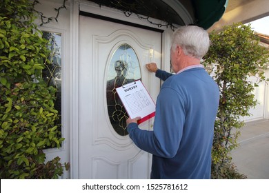 Man Canvassing A Neighborhood Taking A Survey