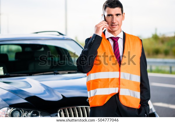 Man with car\
breakdown calling towing\
company