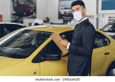 Man Car Dealer Wearing Protective Medical Mask On His Working Place