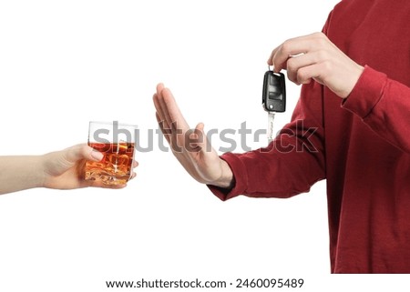 Man with car keys refusing alcohol on white background, closeup. Don't drink and drive concept