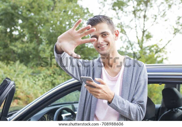 man in the car with the\
mobile phone