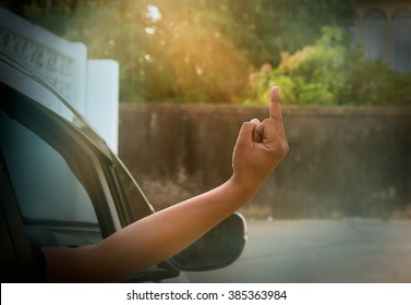 Man In Car Show Middle Finger. Vintage Style, Warm Tone.