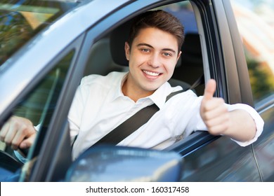 Man In A Car With Thumbs Up