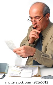 Man is carefully checking bills studio isolated on white background