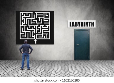 Man carefully studies the plan before entering the labyrinth