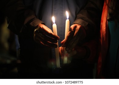 A Man Carry Two Candels At A Peace Manifestation In Colombia