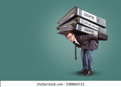 Man Carrying An Enormous Stack Of GDPR Files