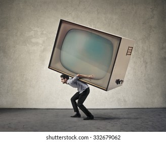 Man Carrying A Giant Tv